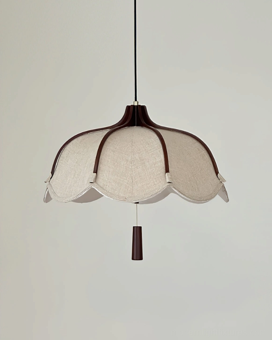 Helia pendant light low-angle upward view in residential living room with crown molding and artwork