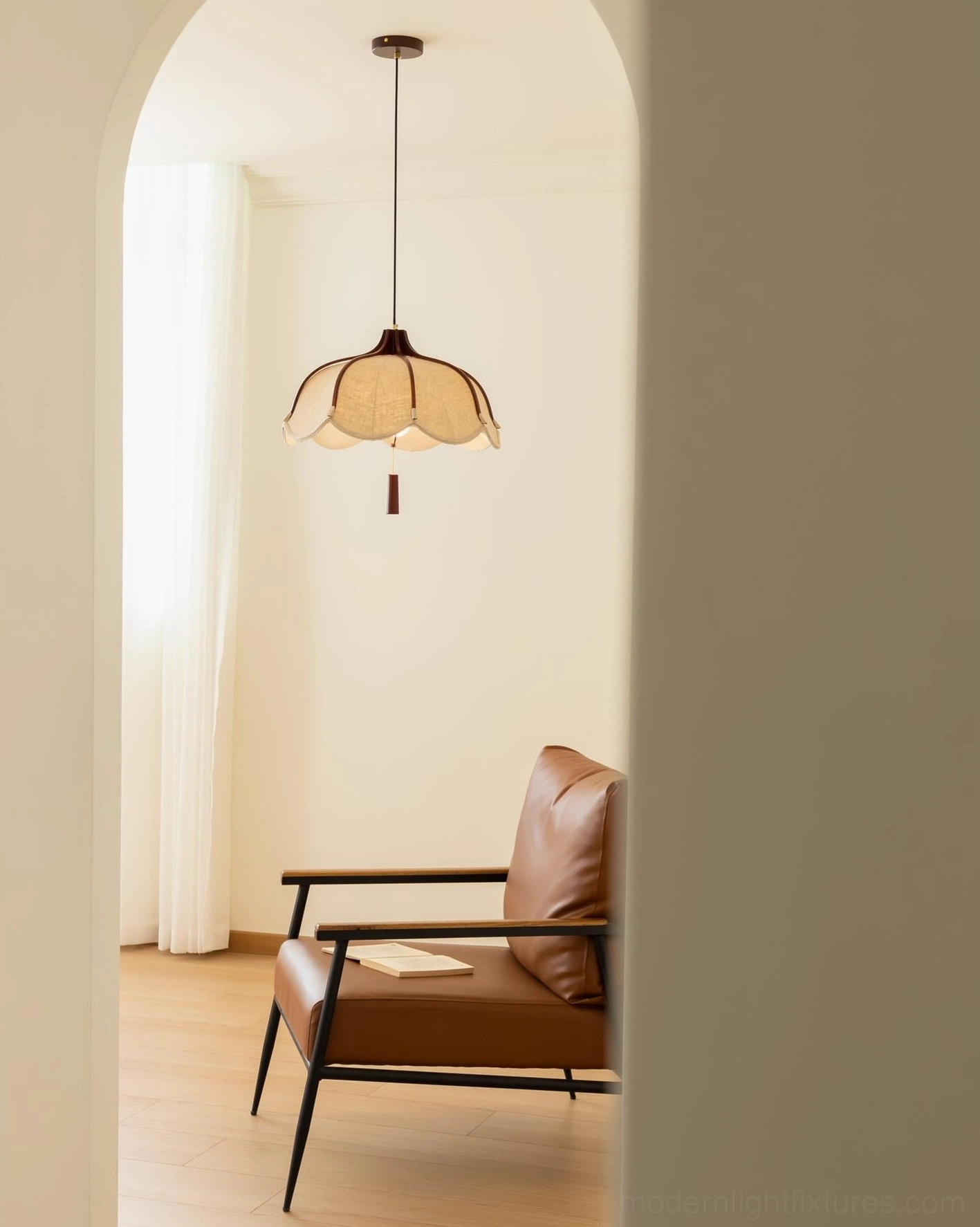 Helia modern pendant light installed in contemporary home hallway with arched doorway and leather armchair