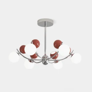 Helio modern chandelier with chrome frame and red white frosted glass globe shades overhead studio view