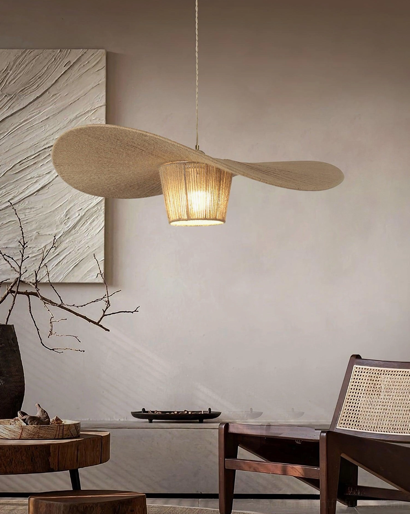 Petal-shaped handwoven hemp rope pendant fixture in leisure lounge with wooden furniture and neutral home decor