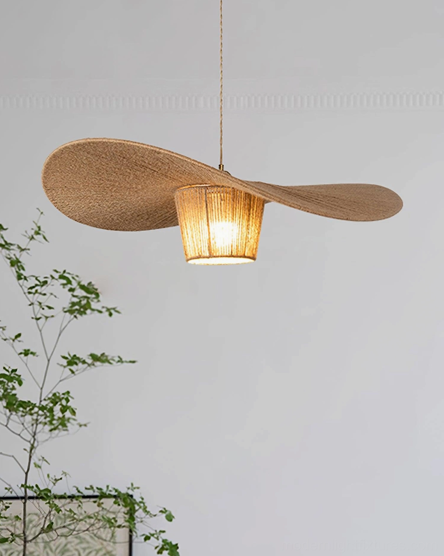 Handwoven hemp rope pendant light installed in residential interior demonstrating ambient warm illumination