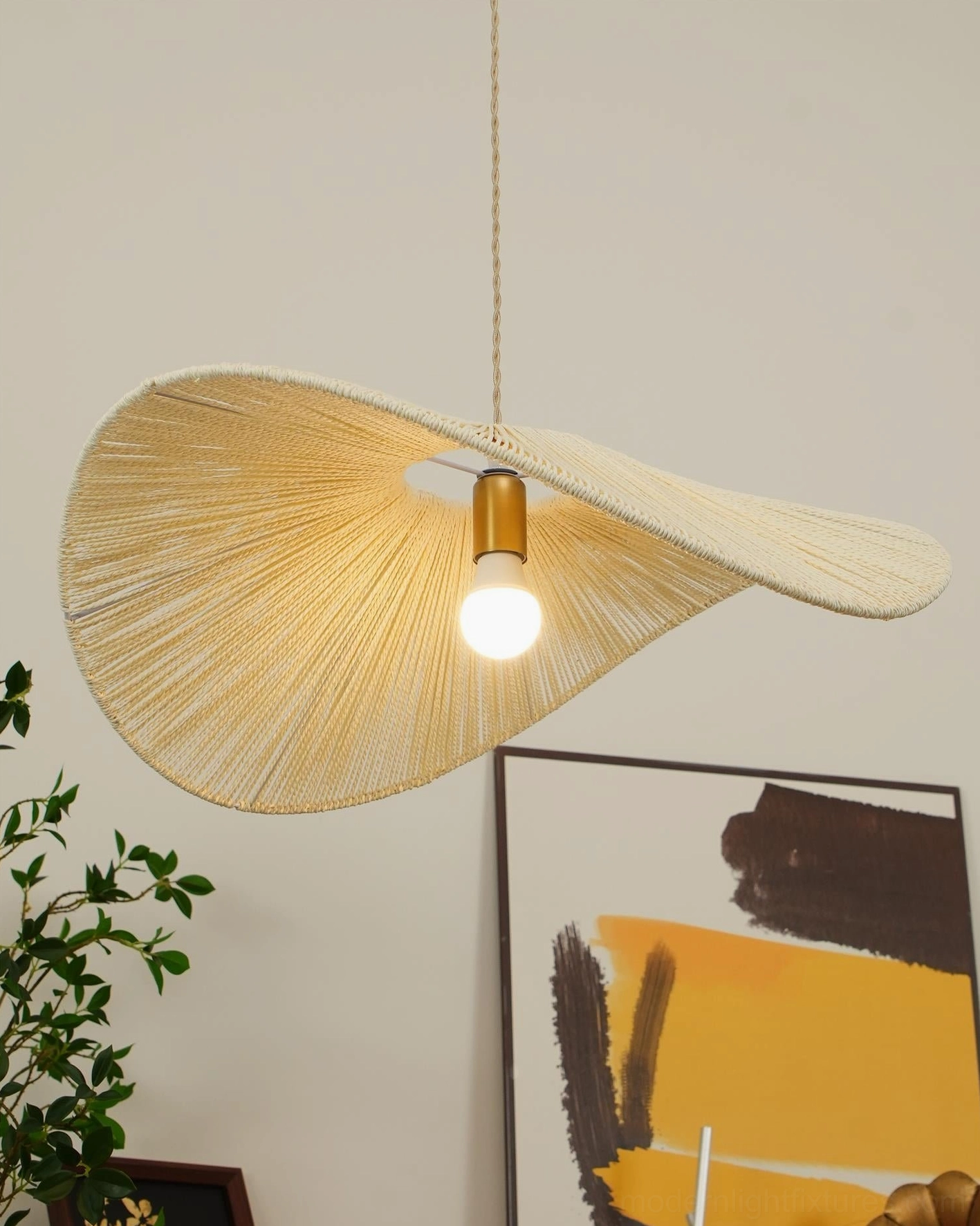 Hemp rope straw hat pendant light installed in Nordic minimalist dining room with wooden furniture