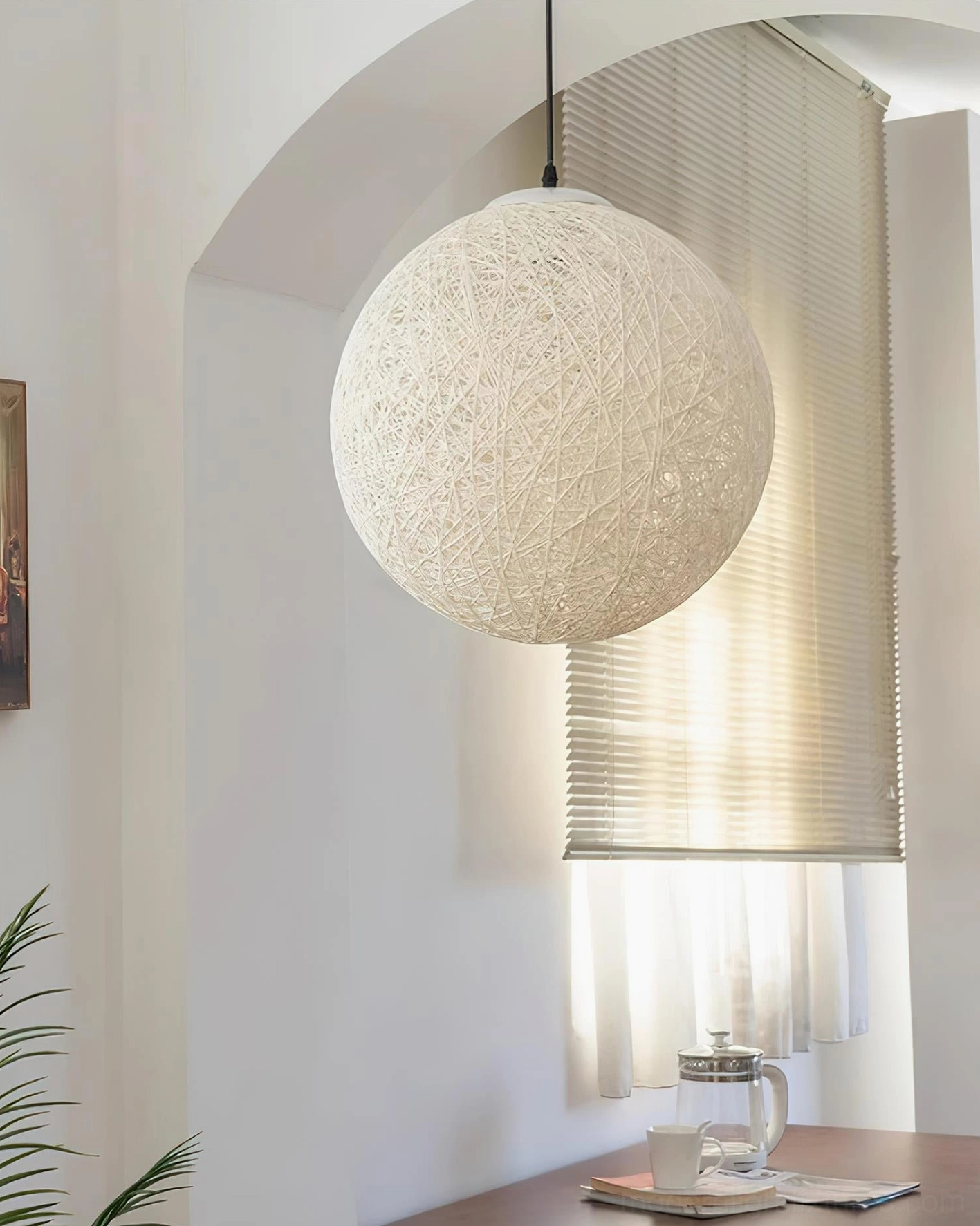 Off-white hemp pendant sphere light fixture showing complete construction and weave pattern on neutral background