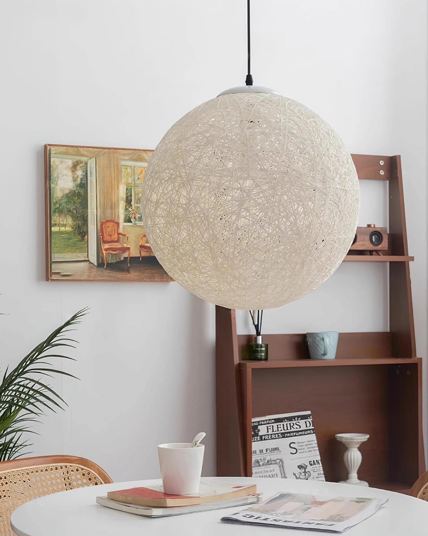 Handwoven hemp sphere pendant fixture detail close-up showing fine weave texture and light diffusion pattern