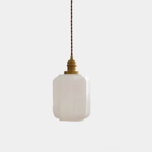 Henry modern tapered glass pendant light with brass hardware, front studio view on white background