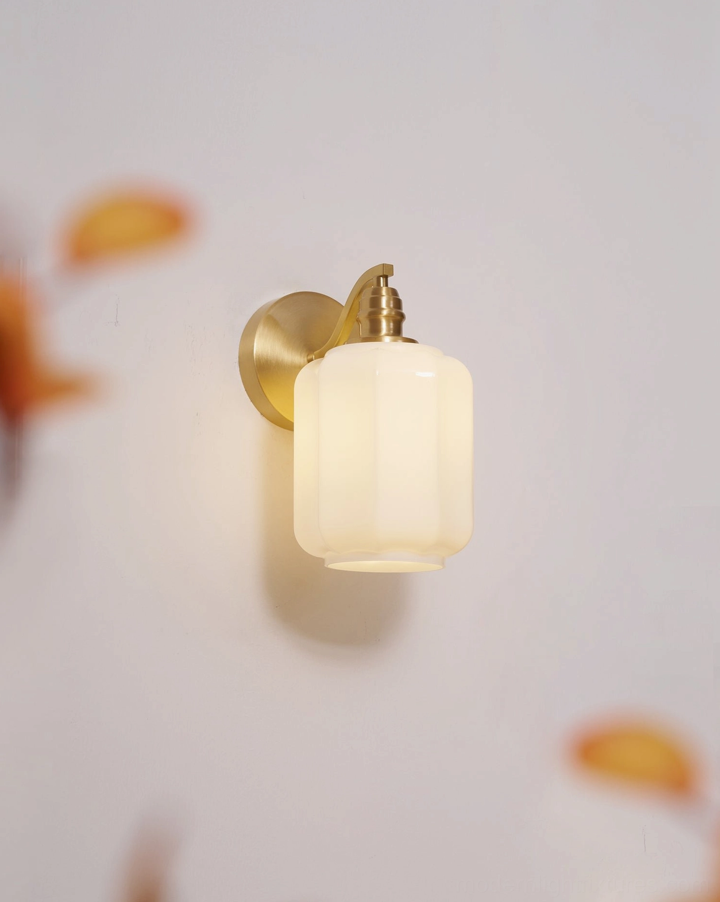 Henry brass wall sconce as accent lighting layer in professional interior design scheme with multiple sources