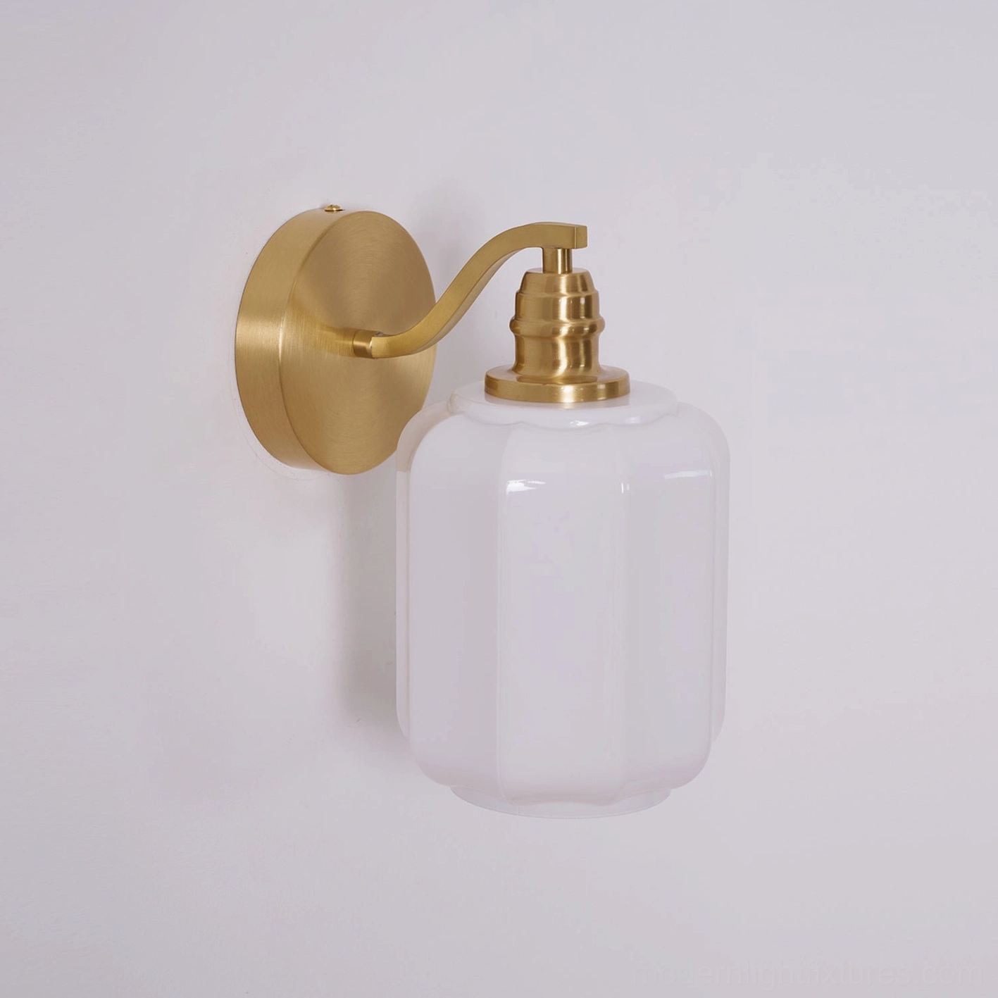 Henry wall sconce mounted beside artwork creating focal point balance in gallery wall composition