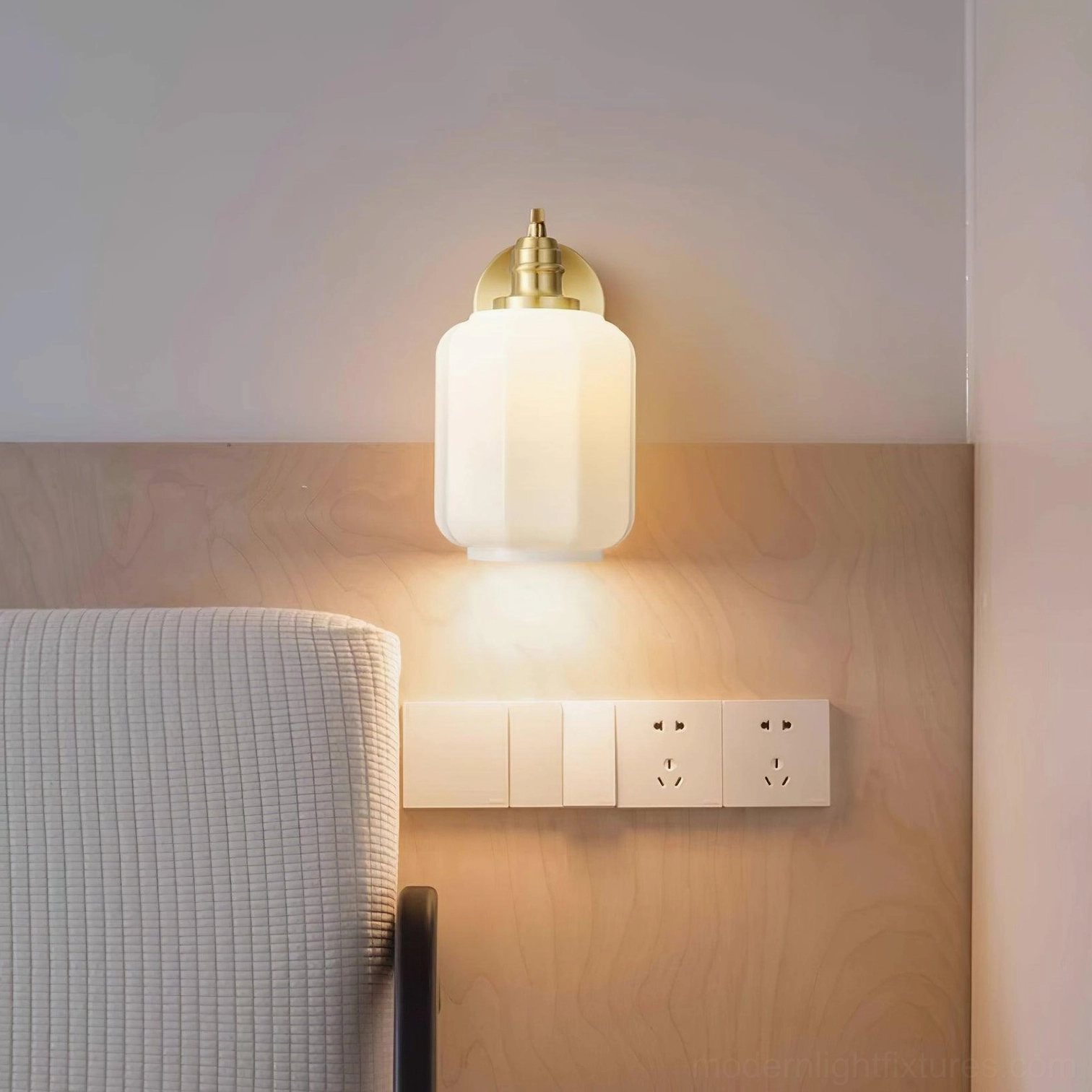 Henry wall sconce installation height reference showing proper mounting beside bathroom mirror for task lighting