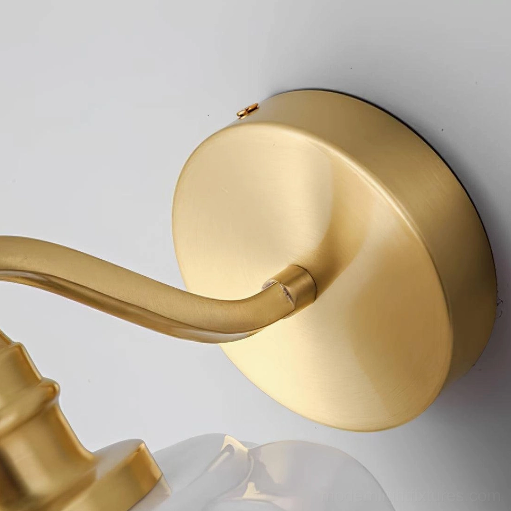 Henry wall sconce providing reading light and bedside ambiance without occupying nightstand surface