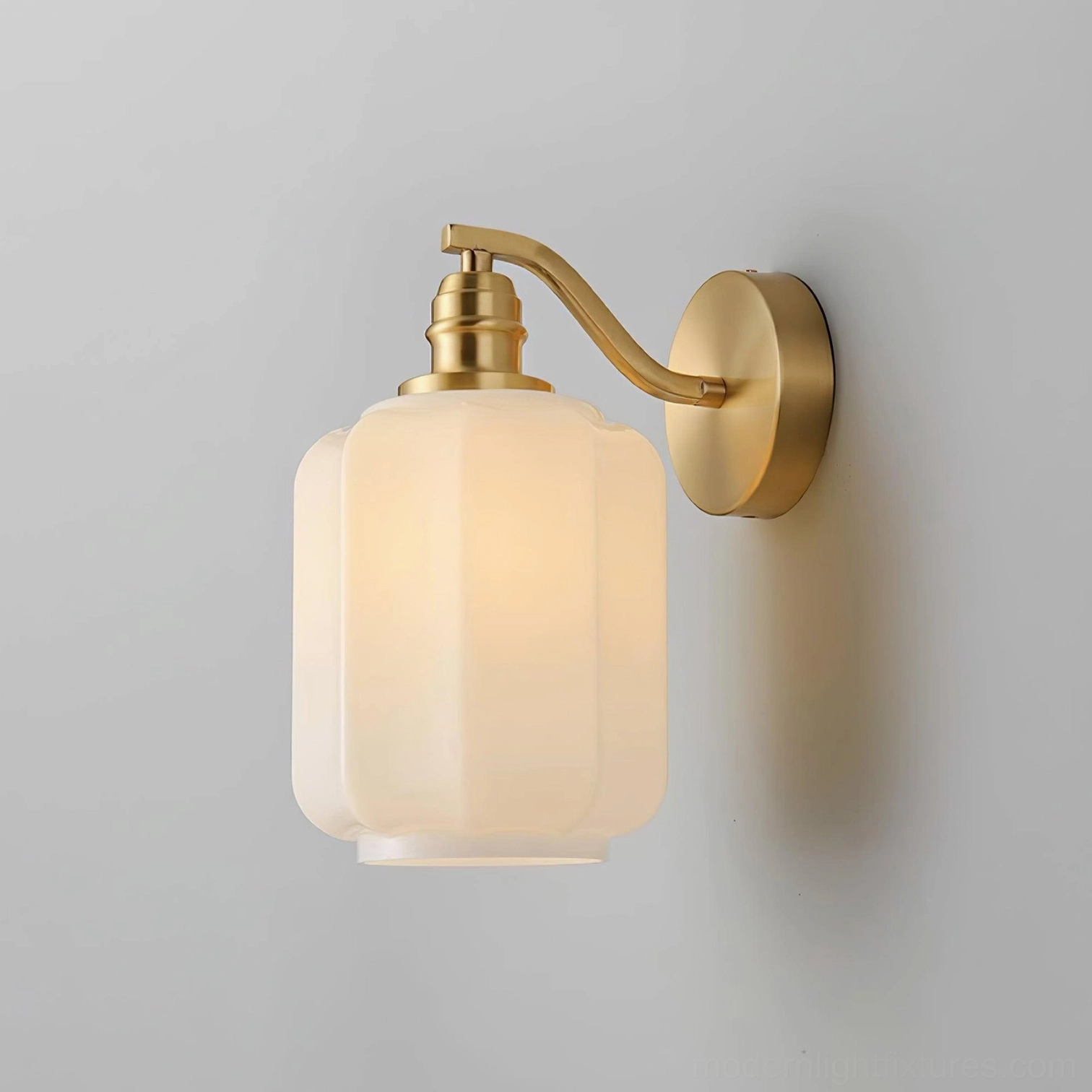 Brass and white glass Henry wall sconce - three-quarter angle showing elegant curved arm and glass diffuser