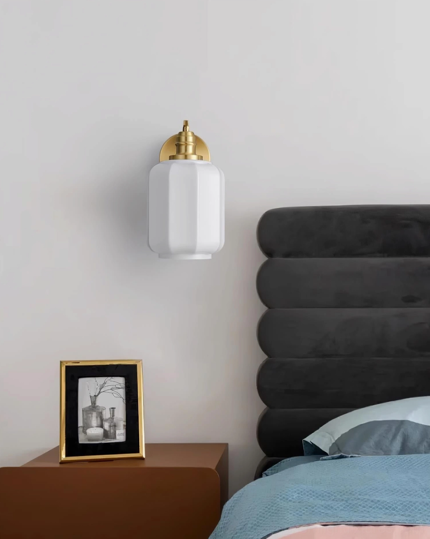 Henry brass wall sconce in hallway creating welcoming entryway illumination with frosted glass