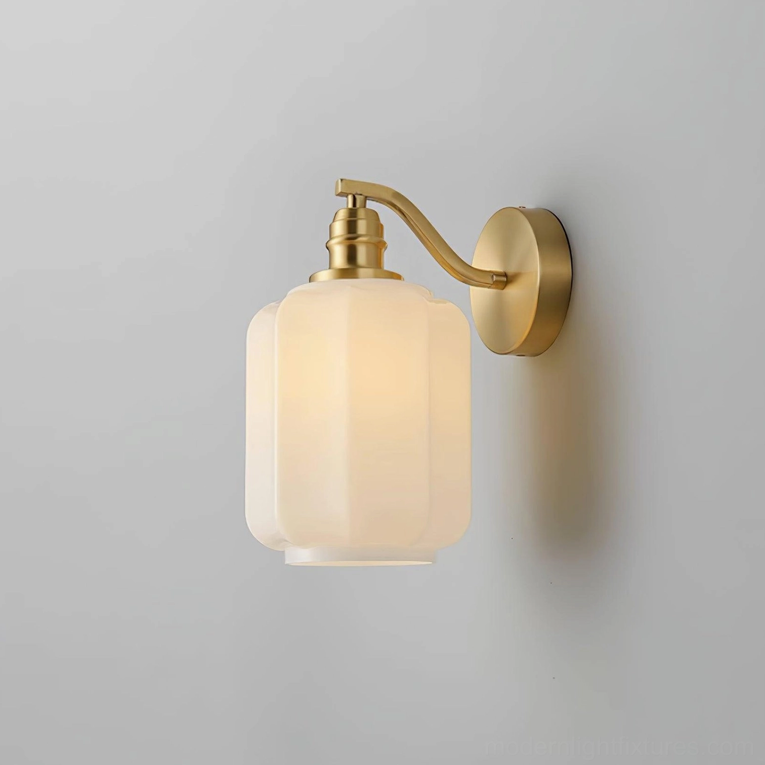 Henry wall sconce providing functional task lighting while maintaining minimal visual profile on wall