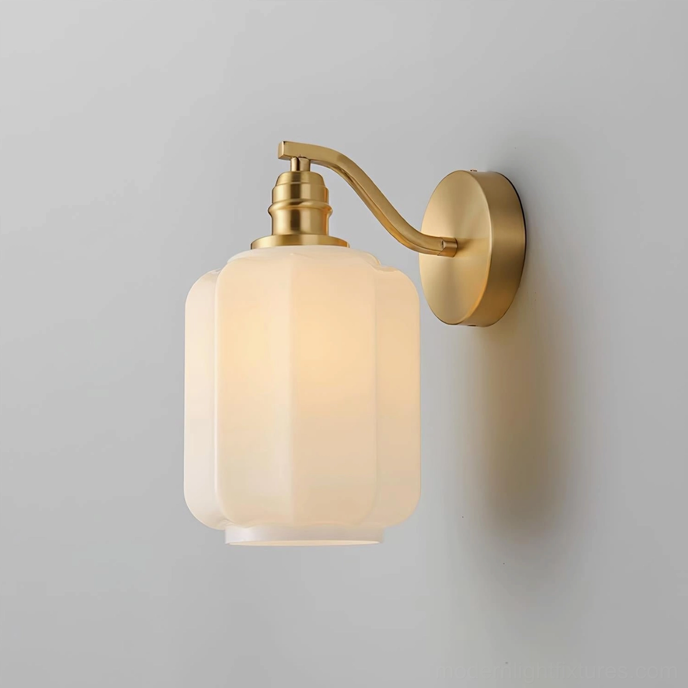 Henry frosted glass wall sconce with brass finish perfect for modern minimalist home decor