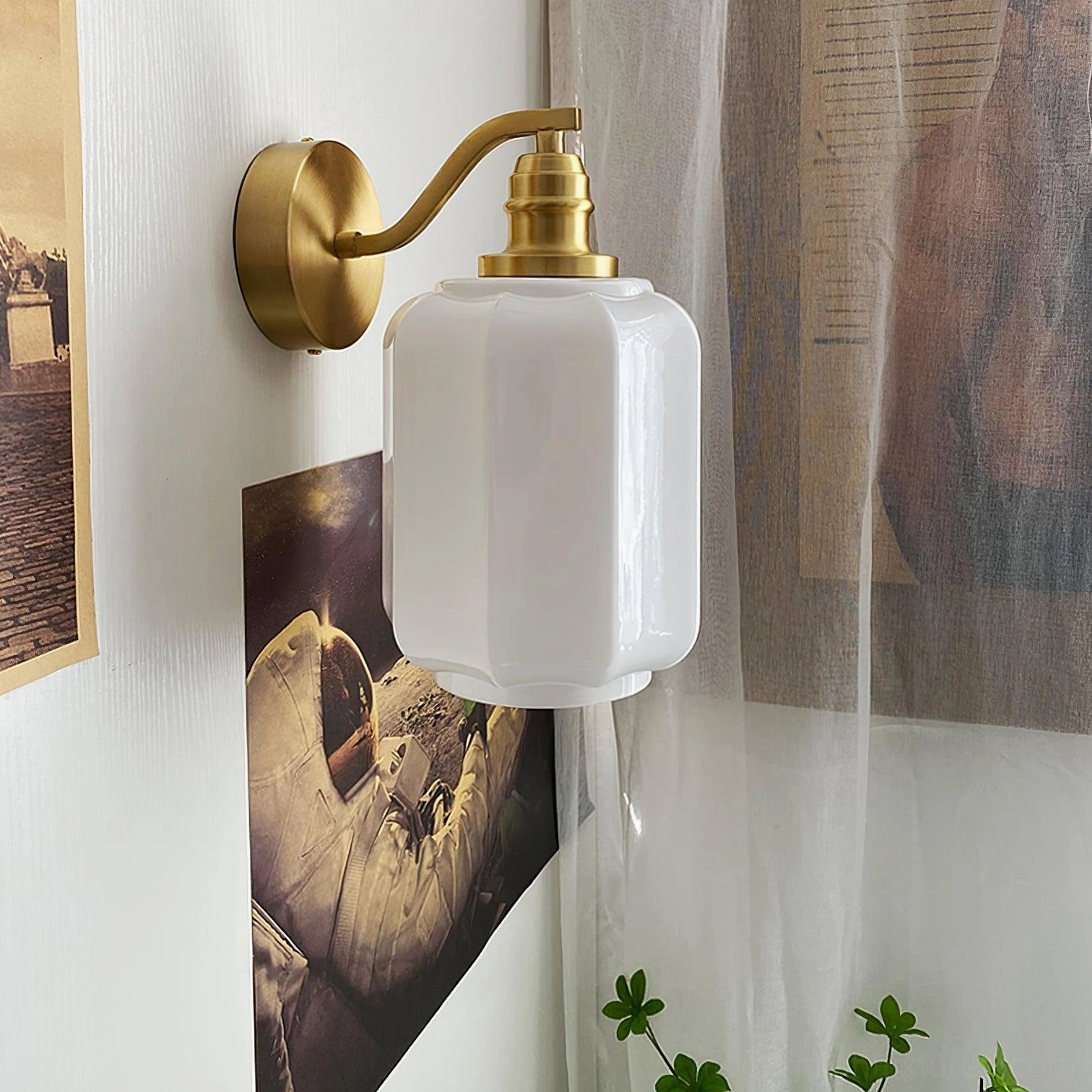 Henry wall sconce mounted at eye level beside mirror creating balanced bilateral symmetry in bathroom design