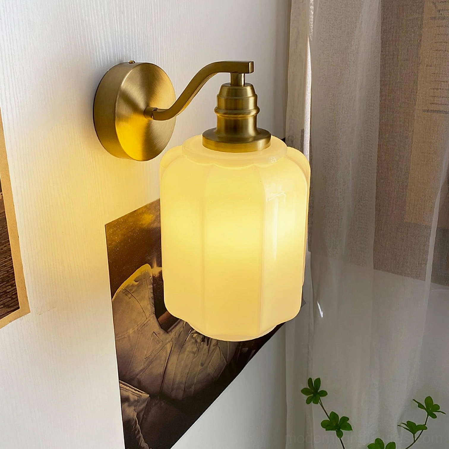 Henry wall sconce installed in modern living room corner providing warm ambient light at eye level
