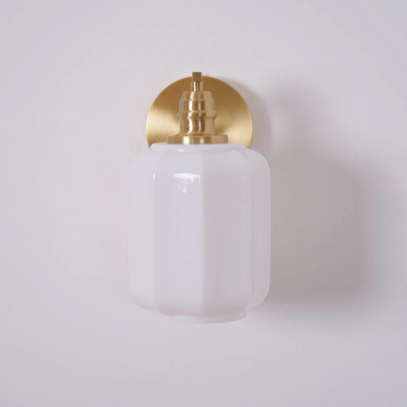 Henry wall sconce product hero shot displaying complete design form against professional backdrop