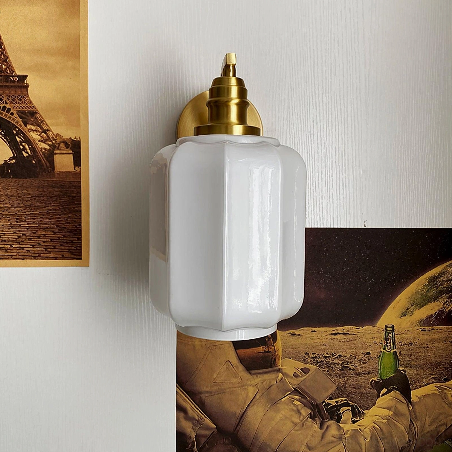 Henry brass wall sconce providing warm layered lighting in contemporary transitional interior design space
