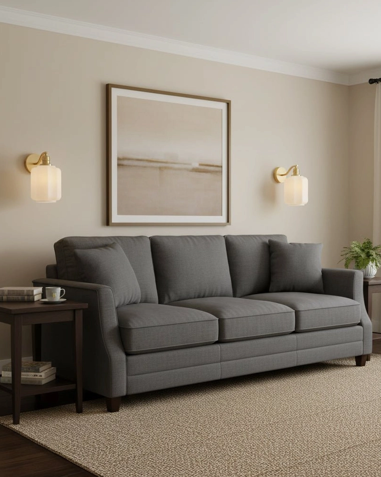 Pair of Henry brass wall sconces symmetrically mounted in contemporary living room for bilateral lighting design