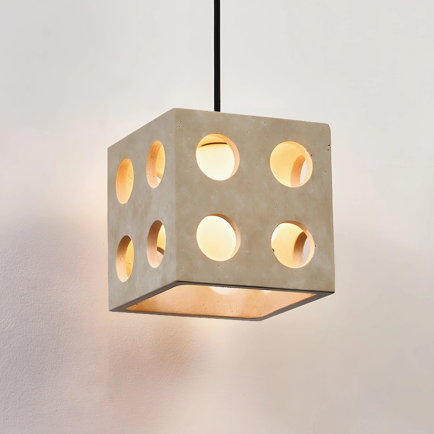 Hexa travertine and glass pendant light detail shot showcasing circular cutout pattern and natural stone texture