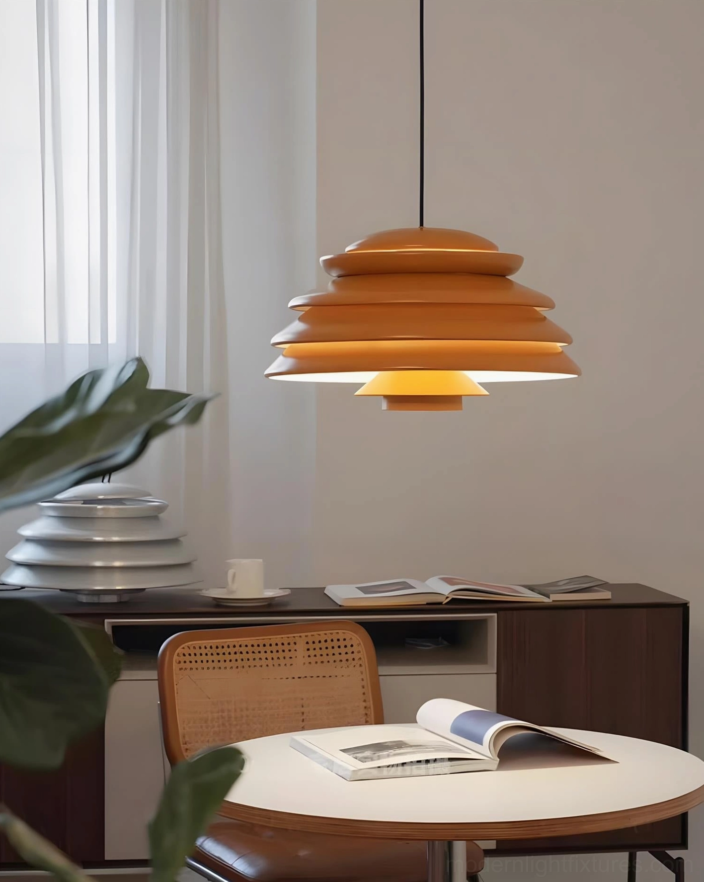 Warm-toned Hive pendant lamp with brown finish suspended in home office workspace, showcasing retro minimalist tiered metal design