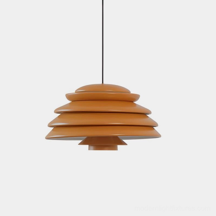 Hive tiered pendant lamp with warm brown wood-tone finish in minimalist studio setting, showcasing sculptural stacked disc design
