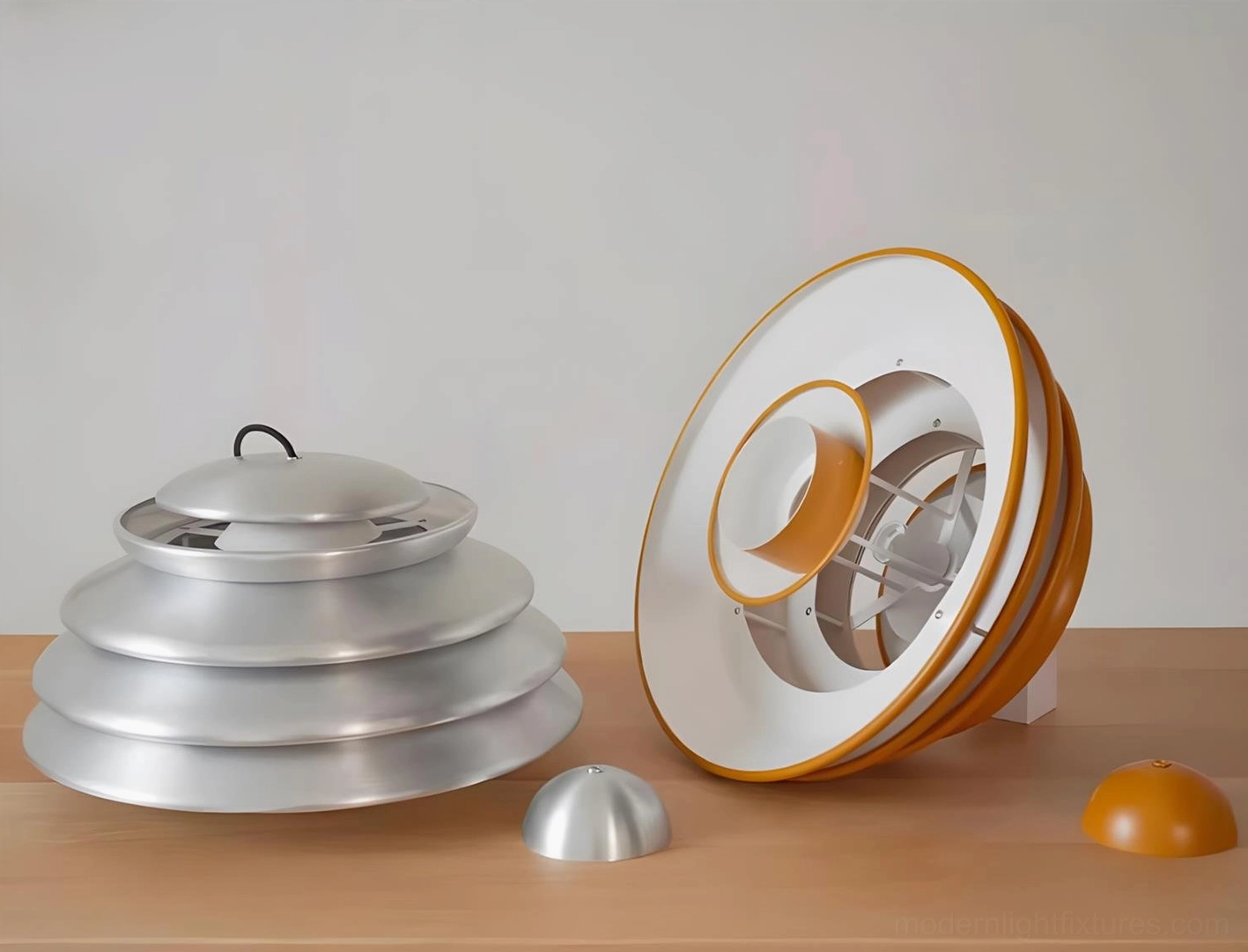 Disassembled Hive pendant lamp components displayed on wooden surface, showing individual tiered aluminum discs in brushed silver and bronze finishes