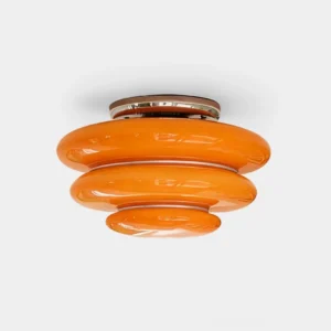 Honey orange tiered glass flush mount ceiling light fixture with polished chrome hardware, studio front view