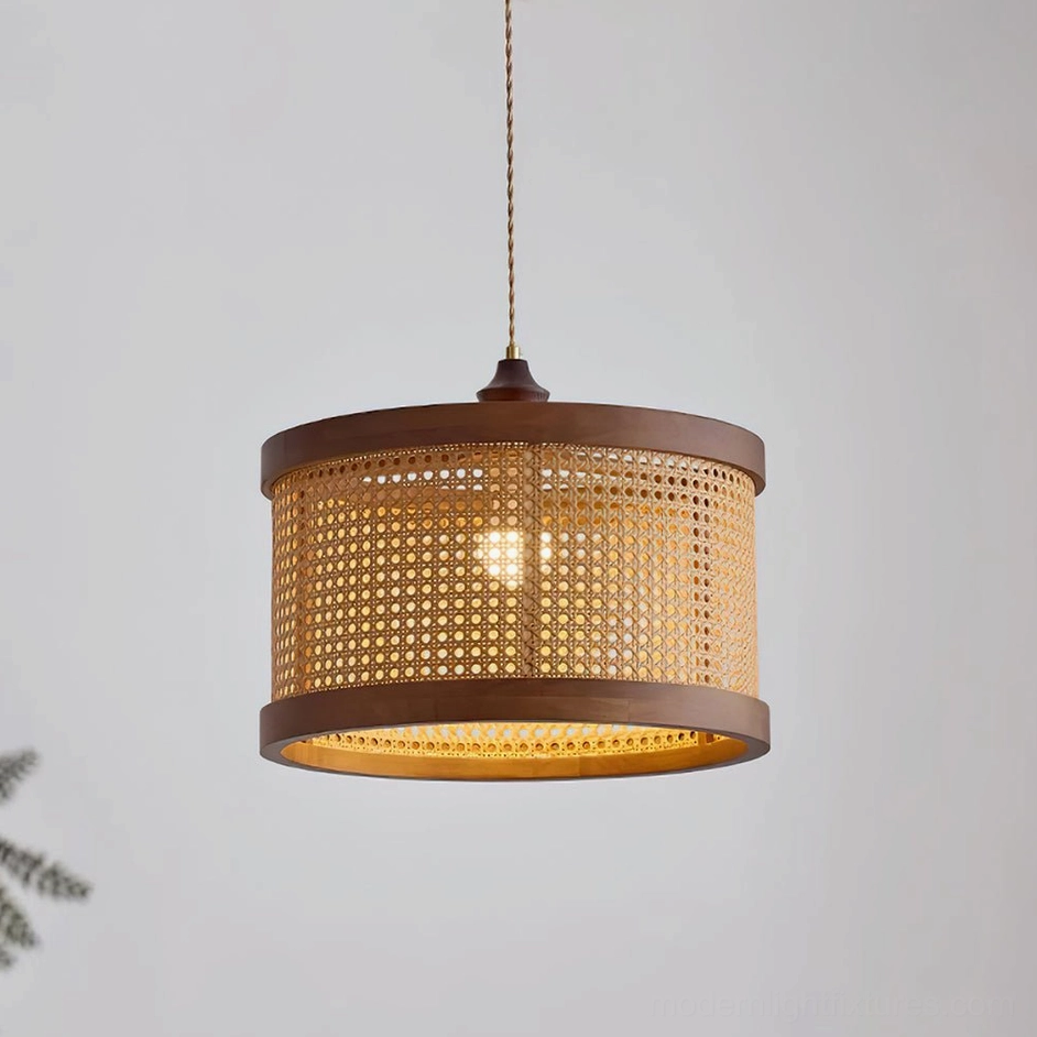 Illuminated Hoopa rattan pendant lamp casting warm light through woven shade texture