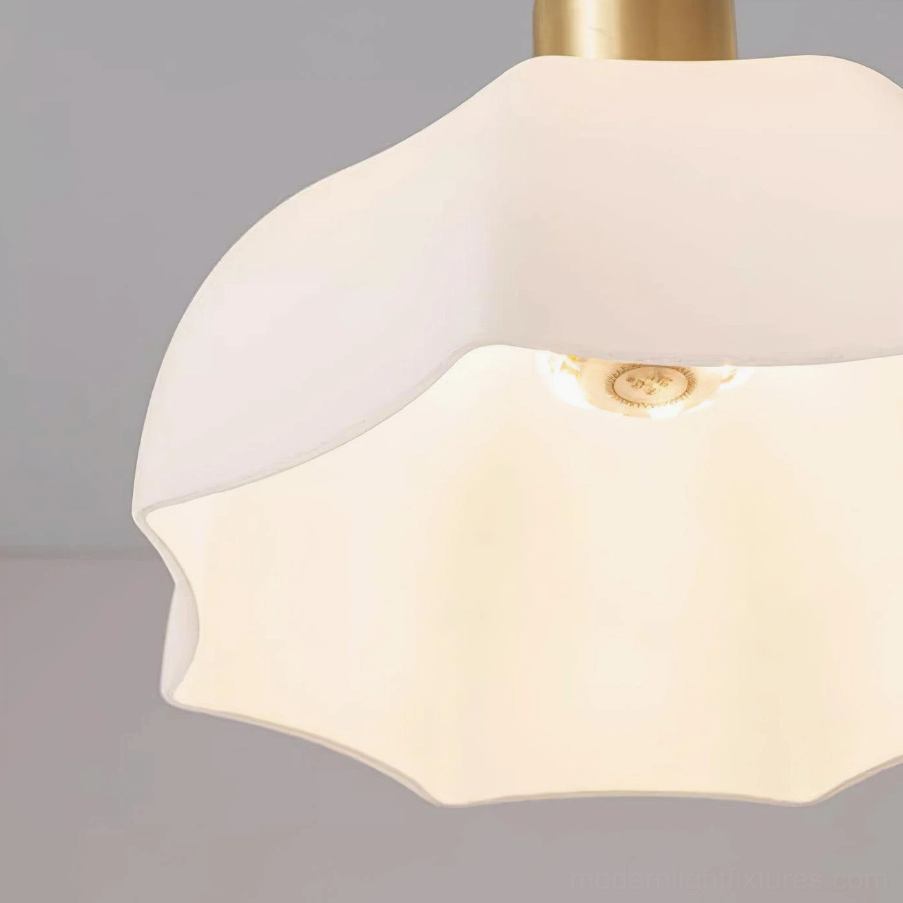 Brass fixture and cord detail of horn scalloped pendant with adjustment capability