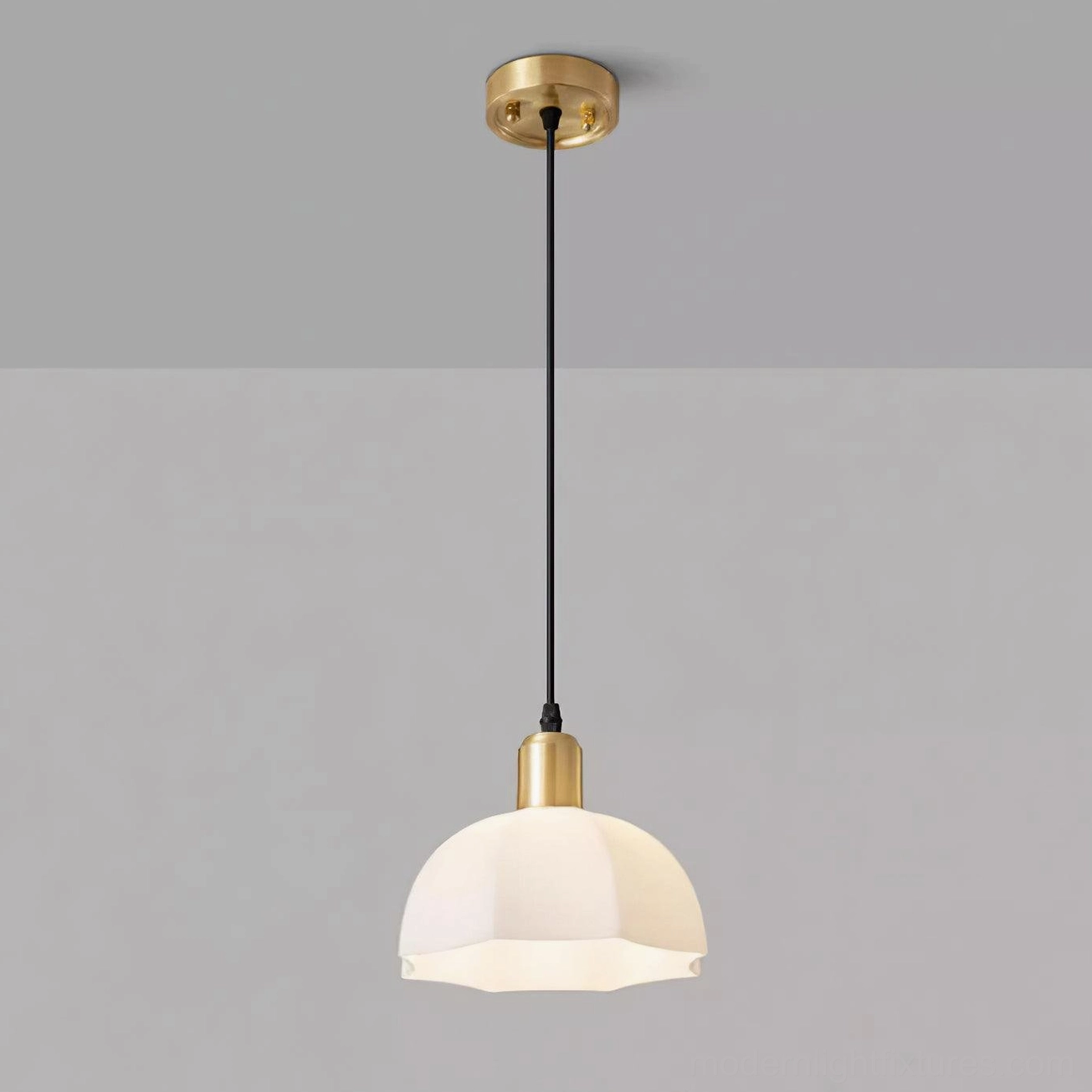 Brass horn scalloped pendant light installation showing cord adjustment and ceiling mount