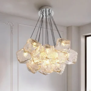 Ice cube glass pendant light installed in luxury bedroom showing warm glowing illumination from irregular glass blocks