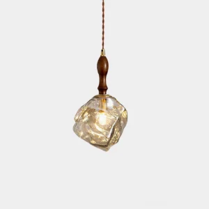 Ice cubes pendant light with faceted glass shade and solid wood cap, studio front view