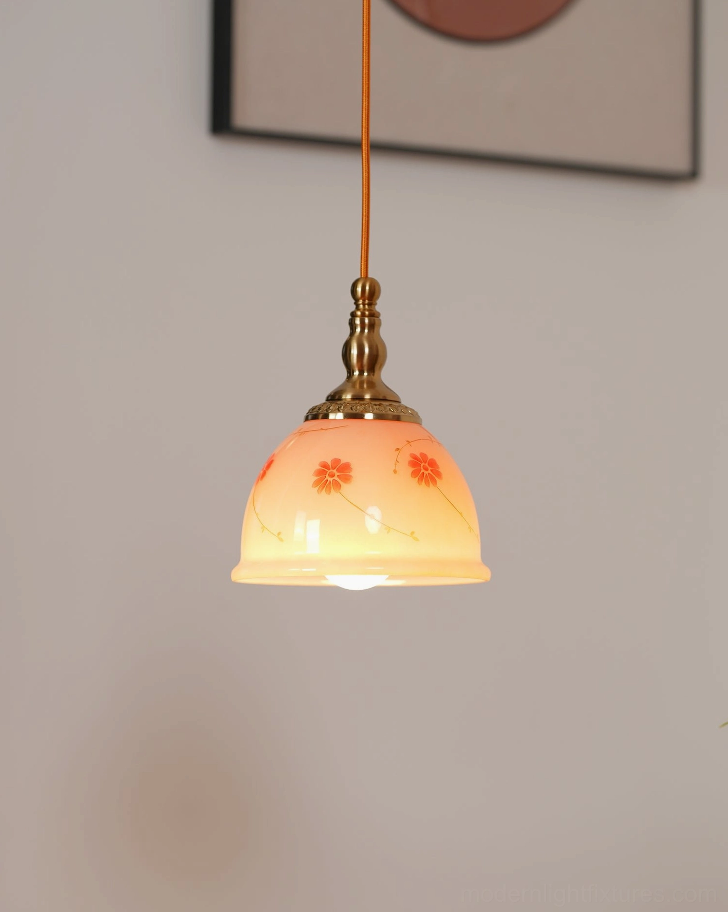 Glowing ceramic floral pendant light installed creating warm romantic vintage ambiance in home interior