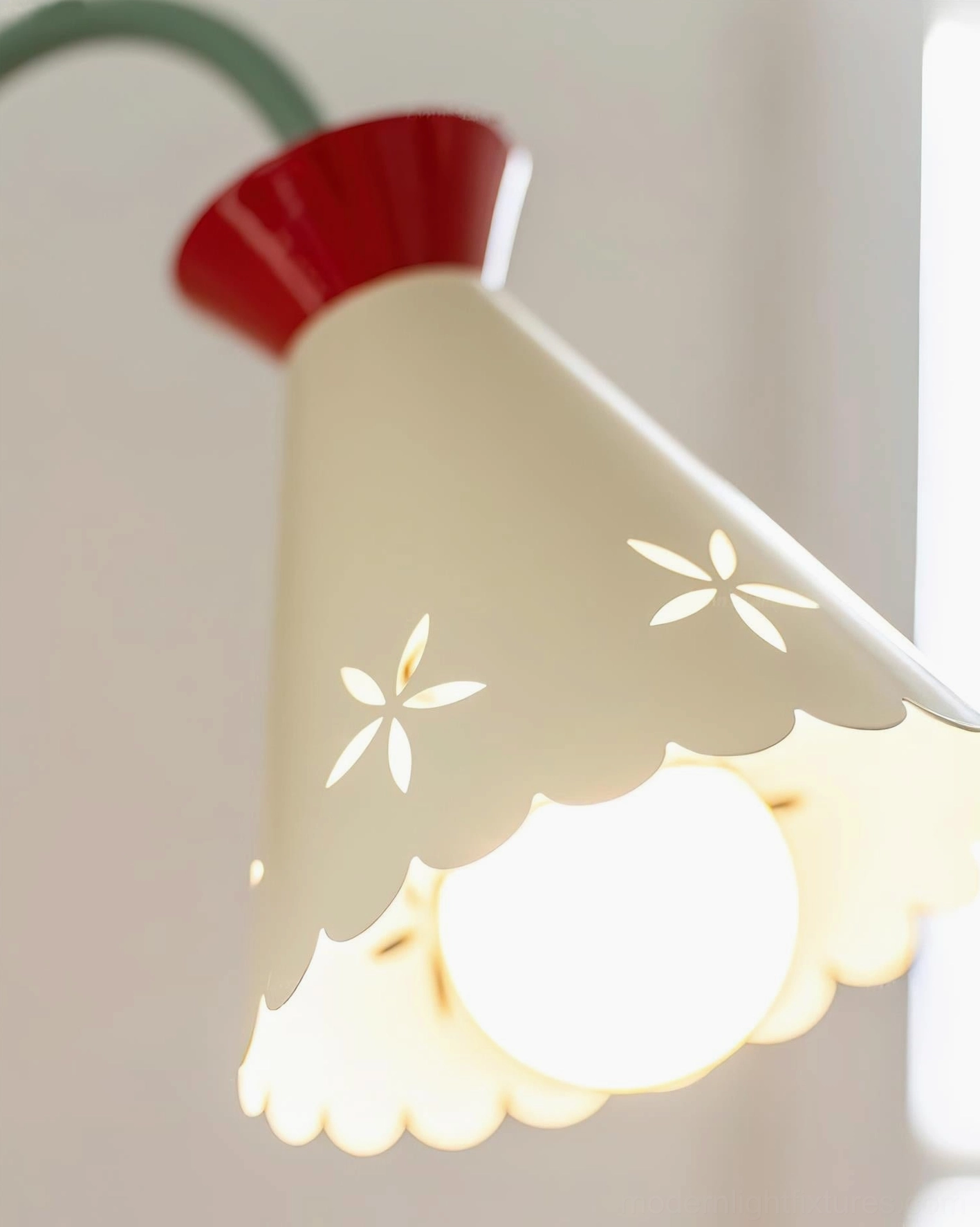 Pastel wall sconce illuminated in warm interior showing ambient glow effect
