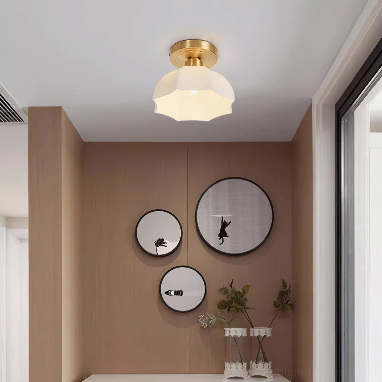 Illuminated scalloped ceiling light creating warm ambient glow in residential interior