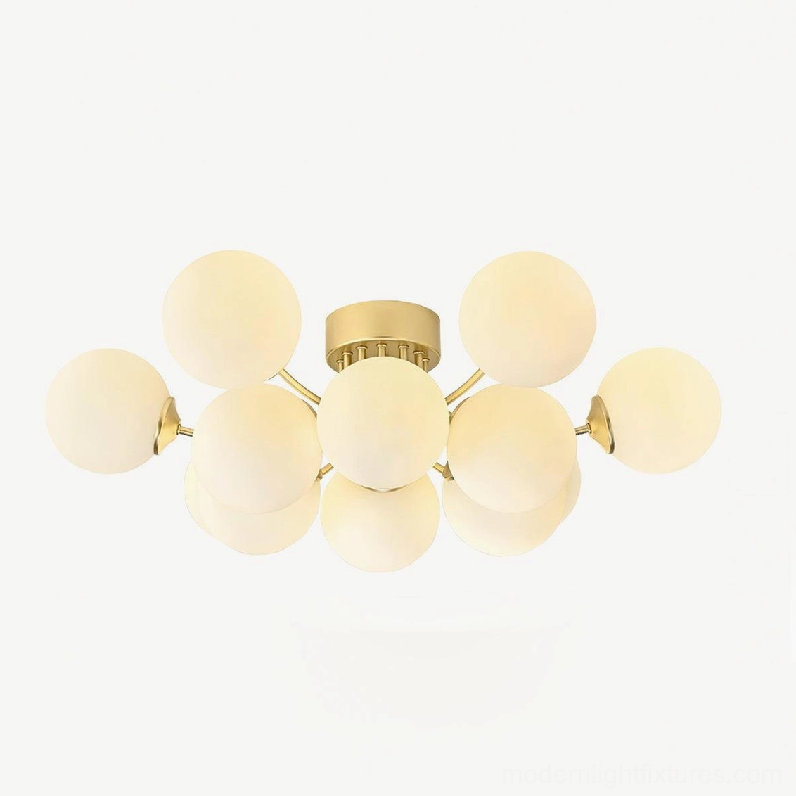 Sputnik ball ceiling light illuminated showing warm light through frosted glass shades in room setting