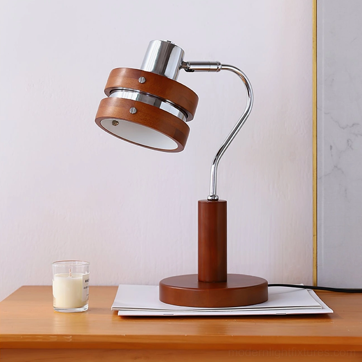 Close-up overhead view of industrial table lamp showing curved chrome arm and layered wooden shade design