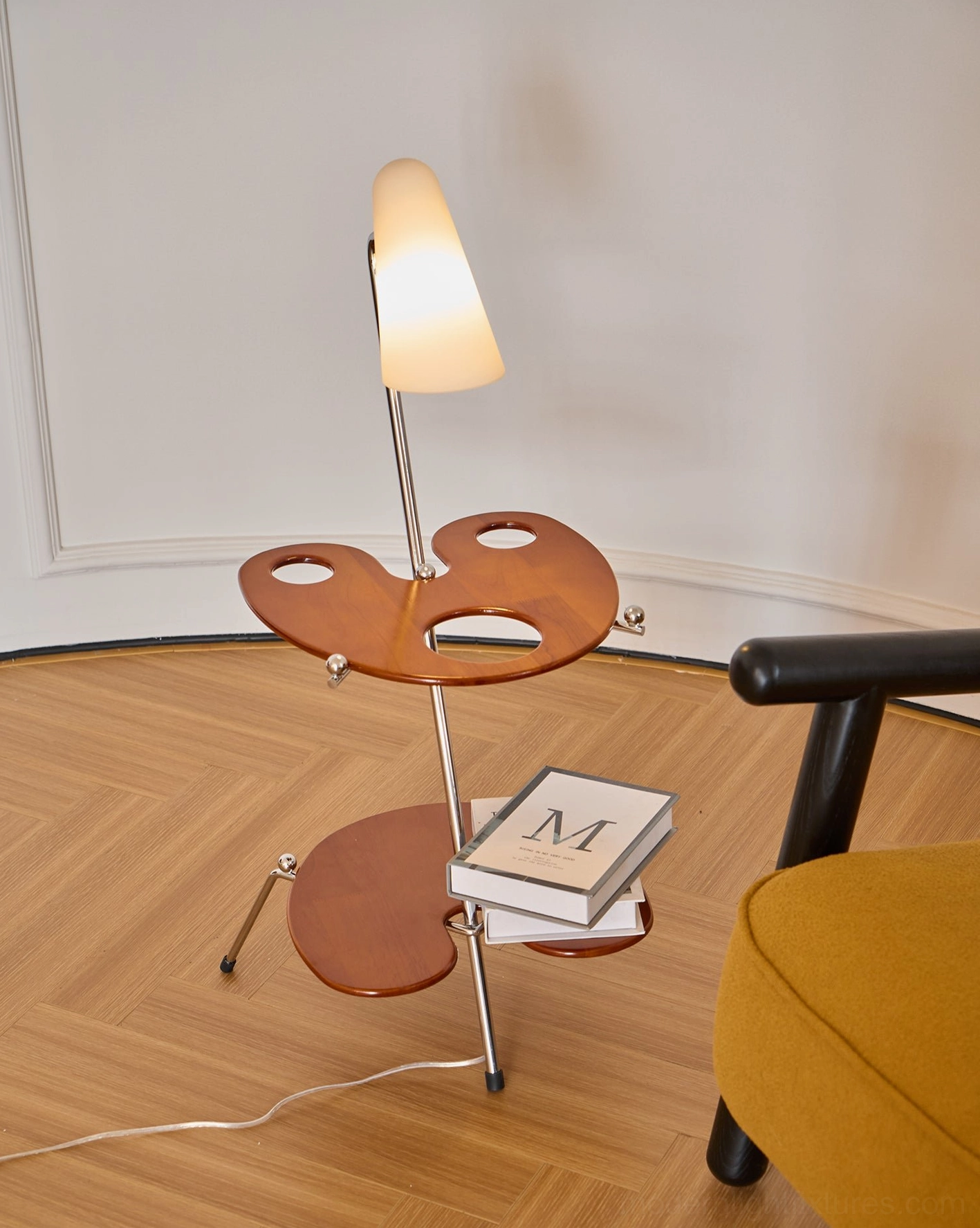 Industrial modern floor lamp with metal framework and wood shelves creating stylish reading nook accent lighting