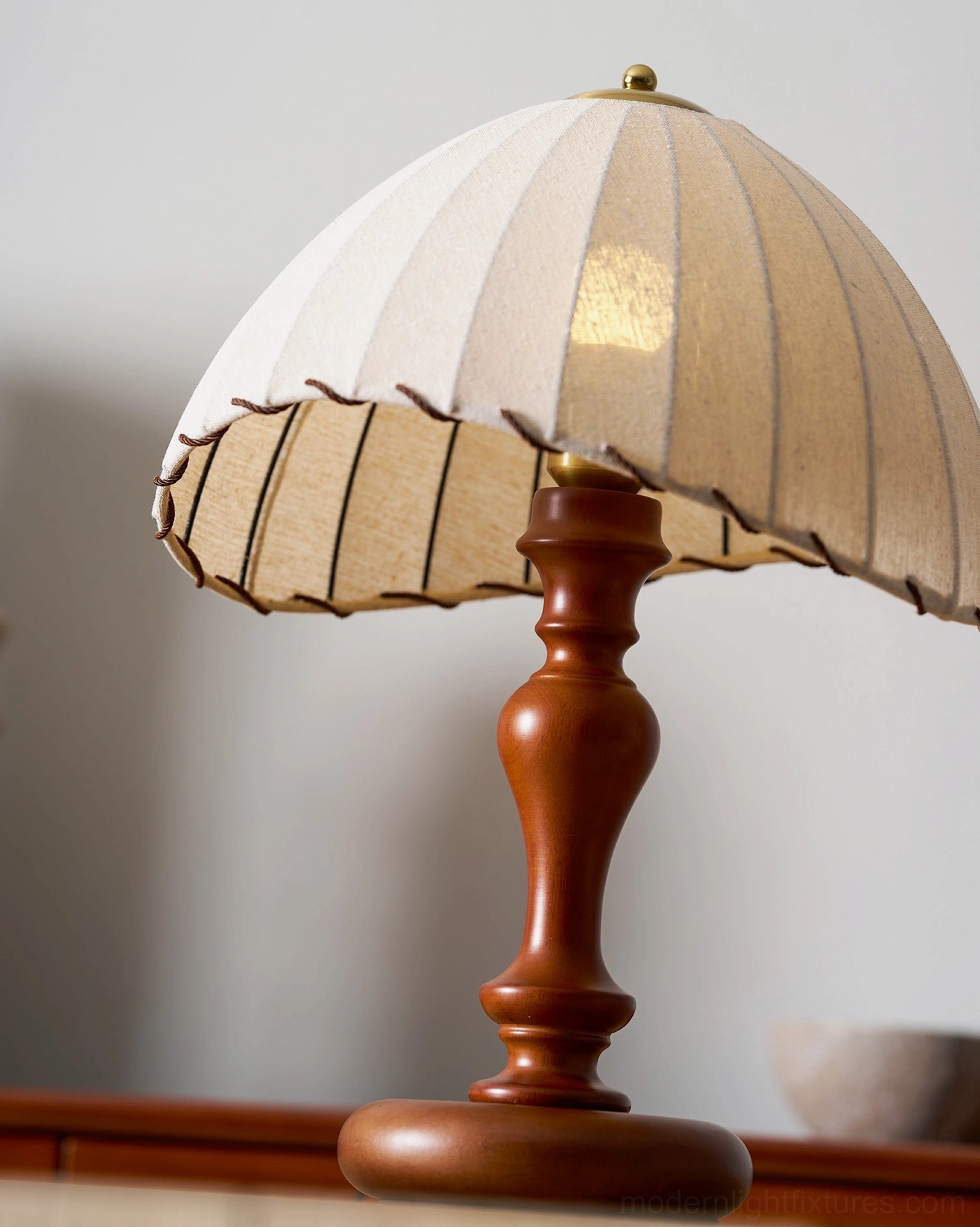 Industrial modern style table lamp pairing pleated shade with classic wood pedestal base
