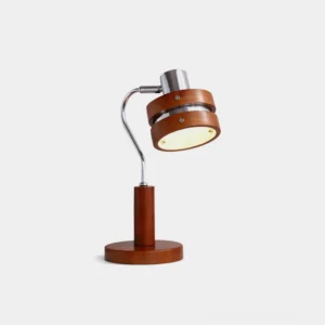 Industrial modern table lamp with adjustable chrome arm and walnut wood barrel shade, front three-quarter studio view