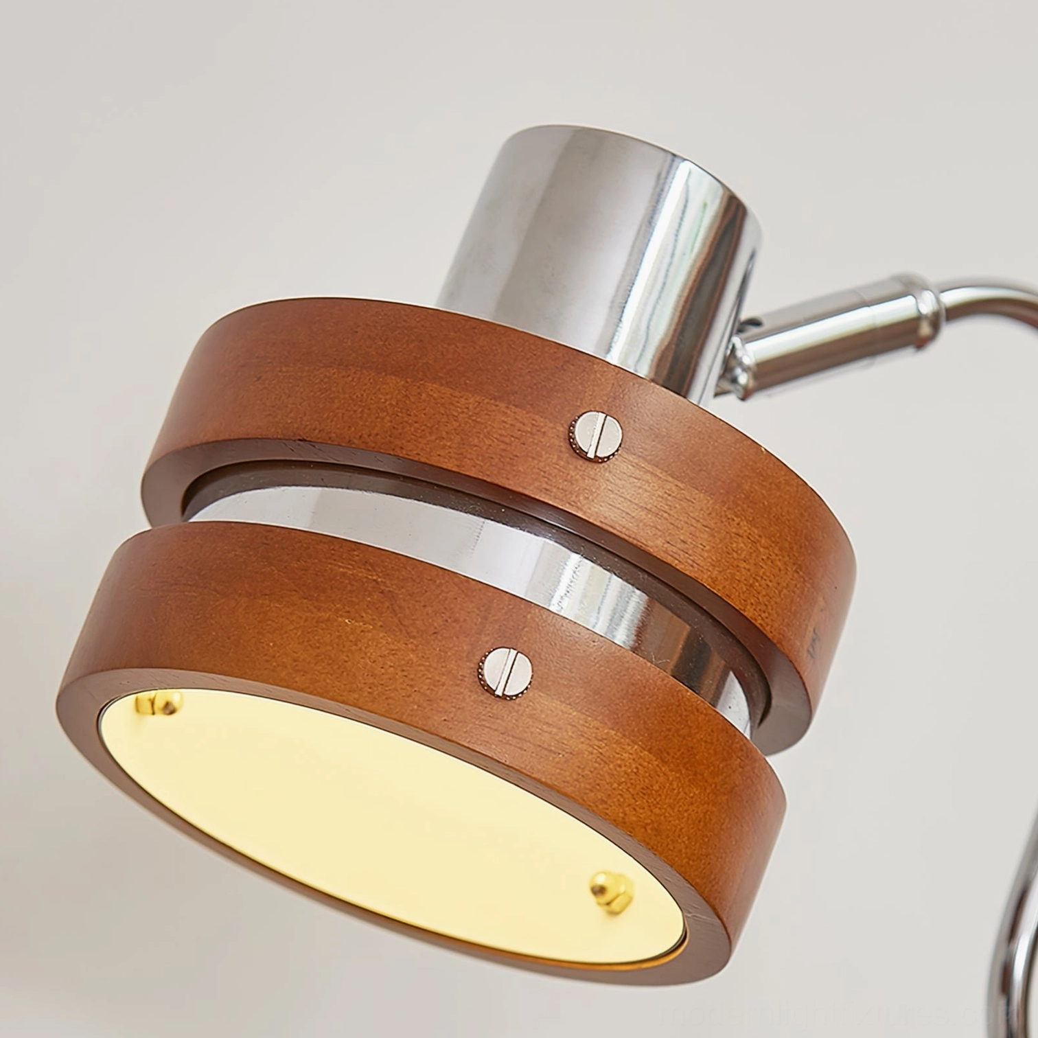 Contemporary industrial table lamp combining walnut wood and polished chrome for modern interior aesthetics