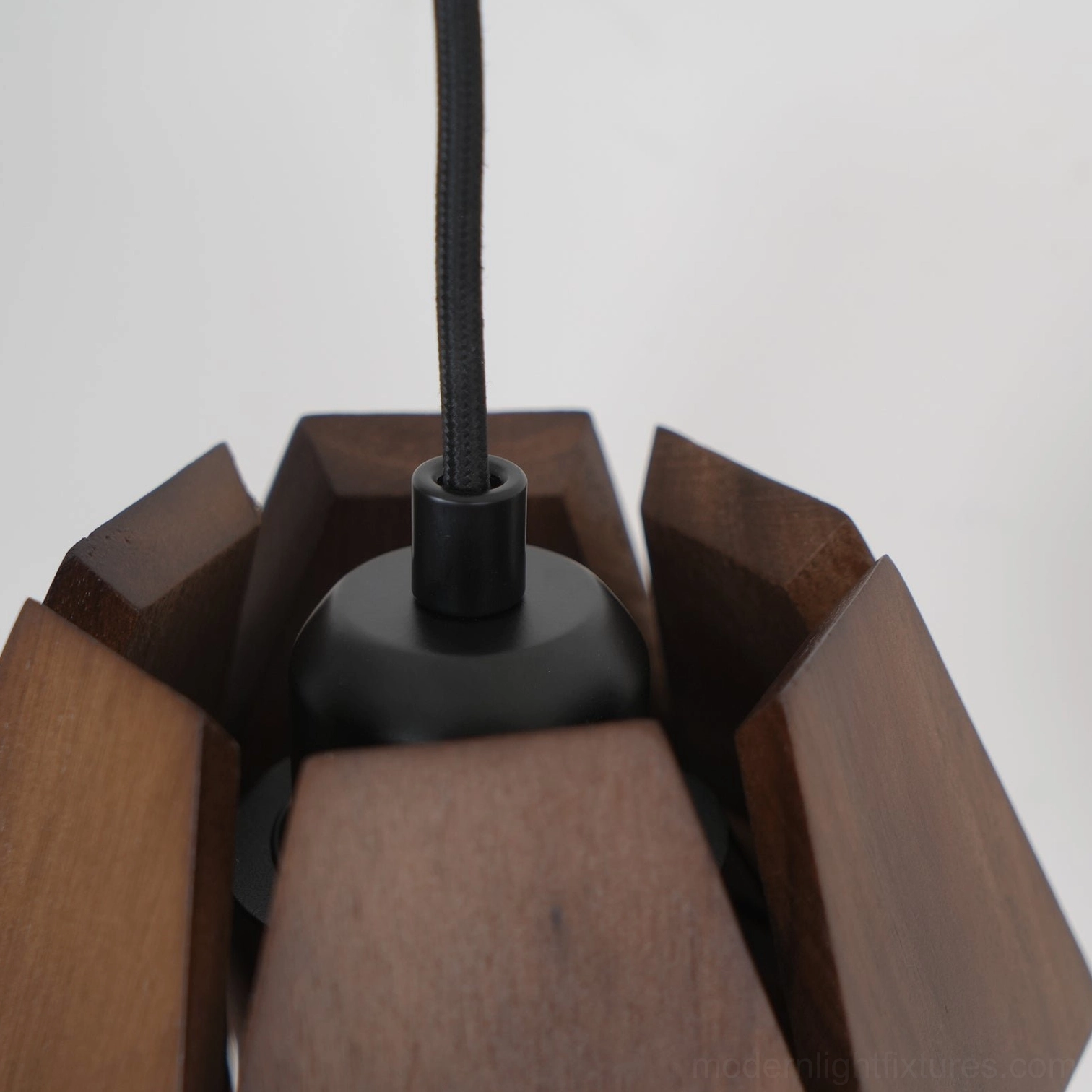 Contemporary faceted wood sconce industrial-modern aesthetic styled room installation