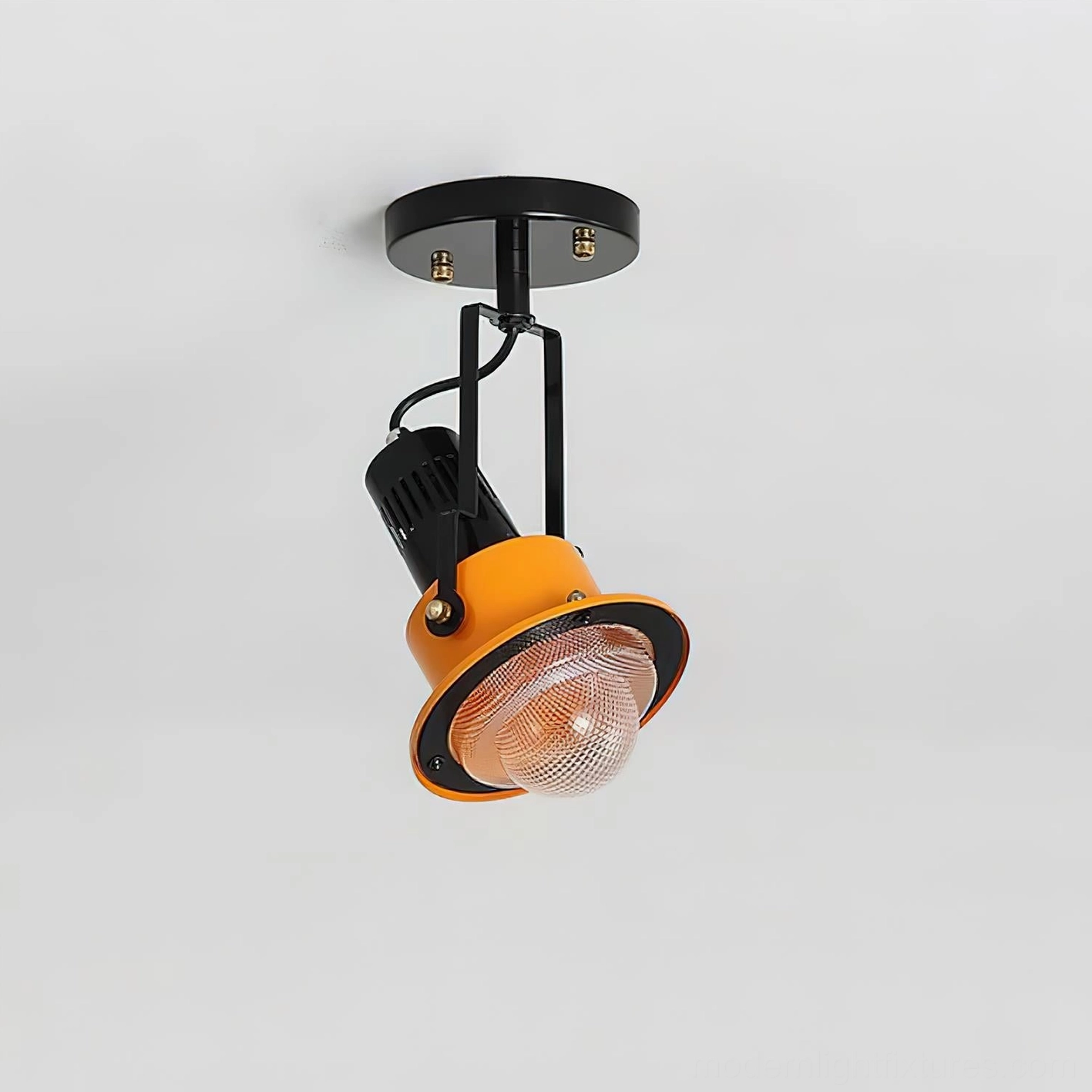 Industrial ceiling lamp with diamond-textured orange glass shade and black metal canopy accent lighting