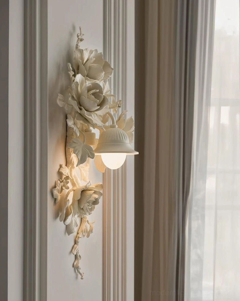 Ivory-white Elysia Bloom rose sconce mounted on wainscoting wall, side perspective showing sculptural depth