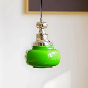 Modern jade green glass pendant light close-up showing glossy glass shade and metal hardware