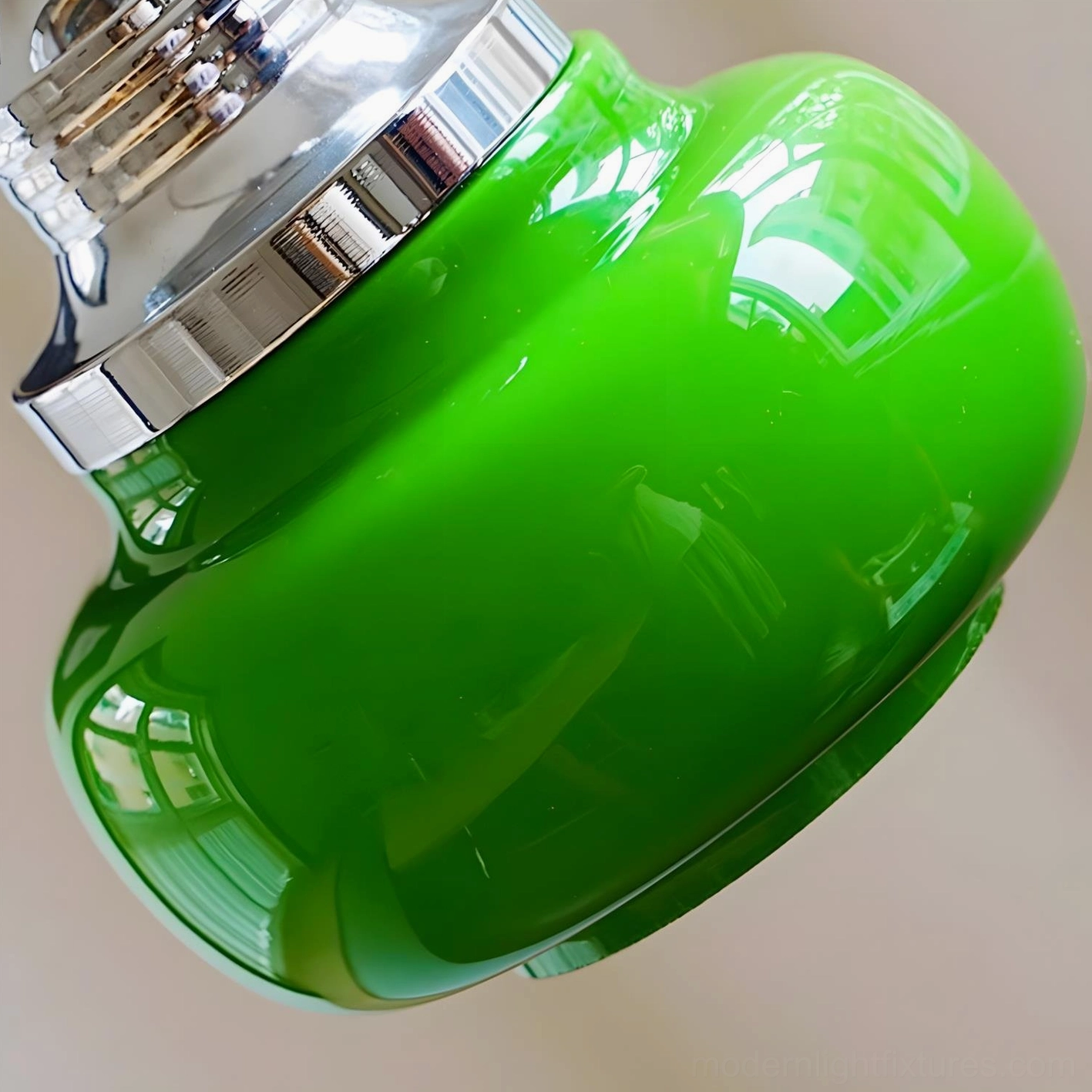 Jade green glass pendant light fixture hanging in modern minimalist home interior space