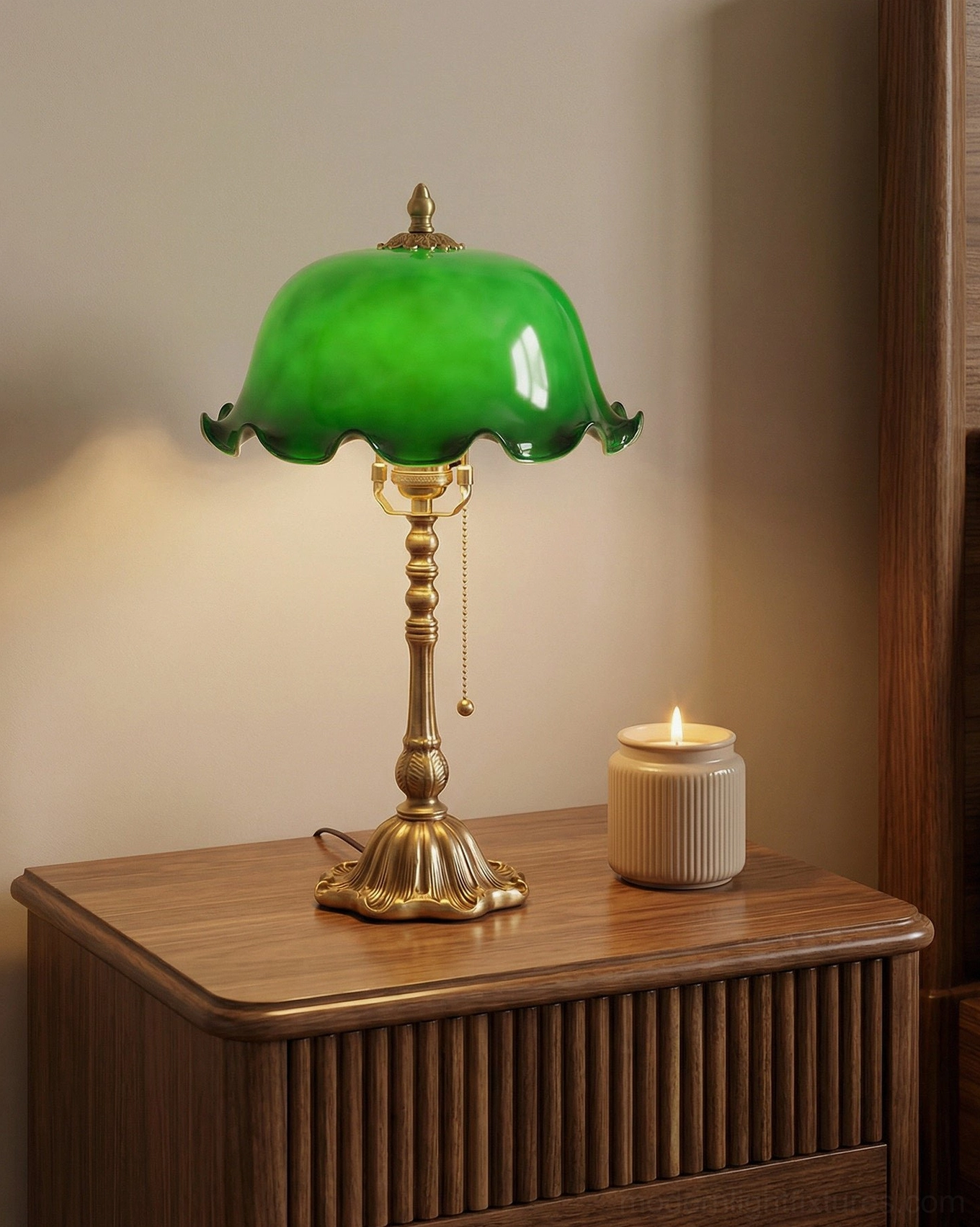 Jadelle green glass dome lamp on wooden nightstand with candle creating warm ambient glow