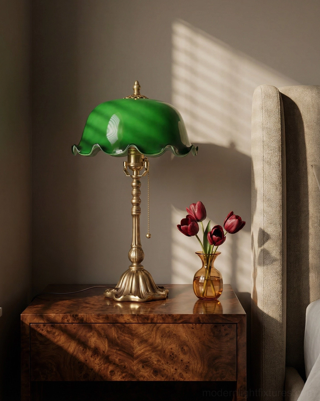 Jadelle brass table lamp on walnut nightstand with red rose vase and natural window light