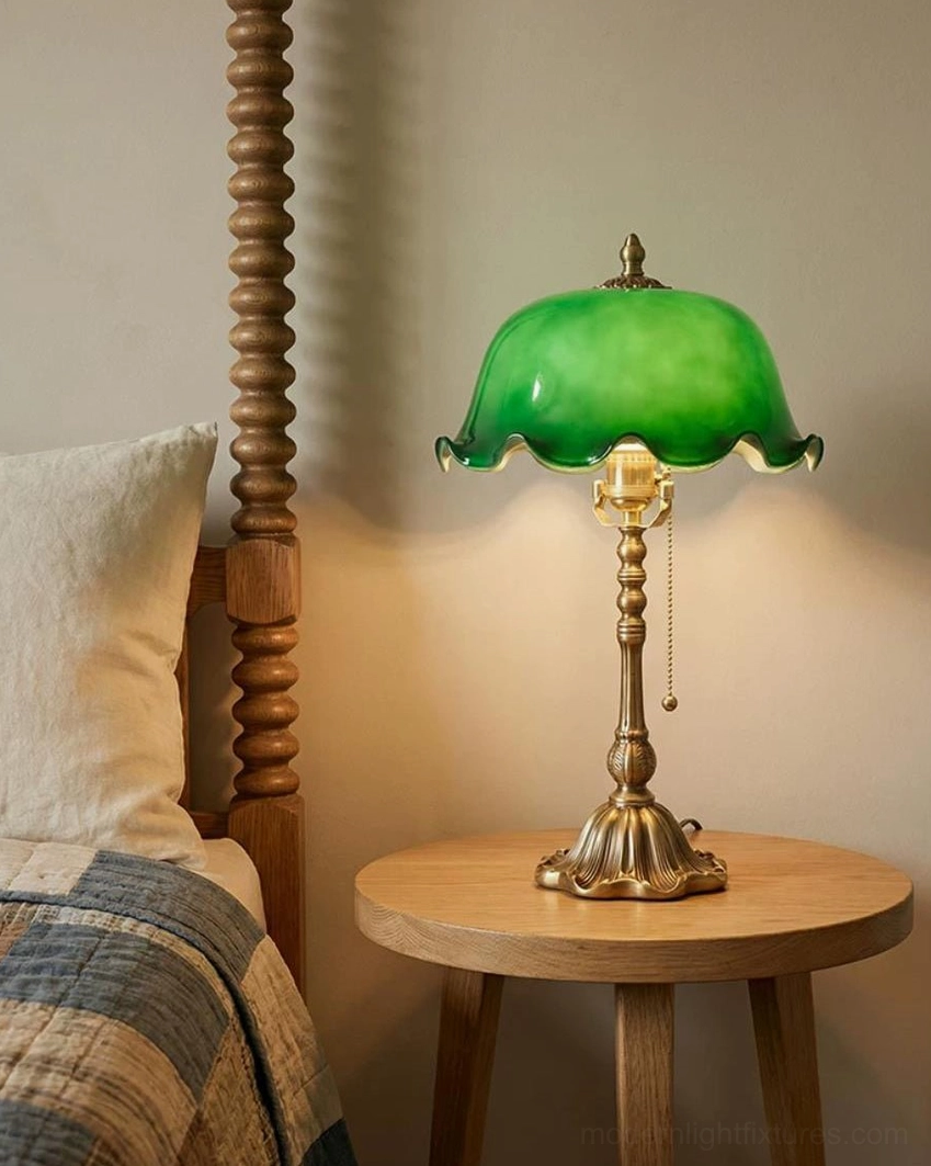 Jadelle vintage dome shade lamp on round wooden side table beside bed with plaid bedding