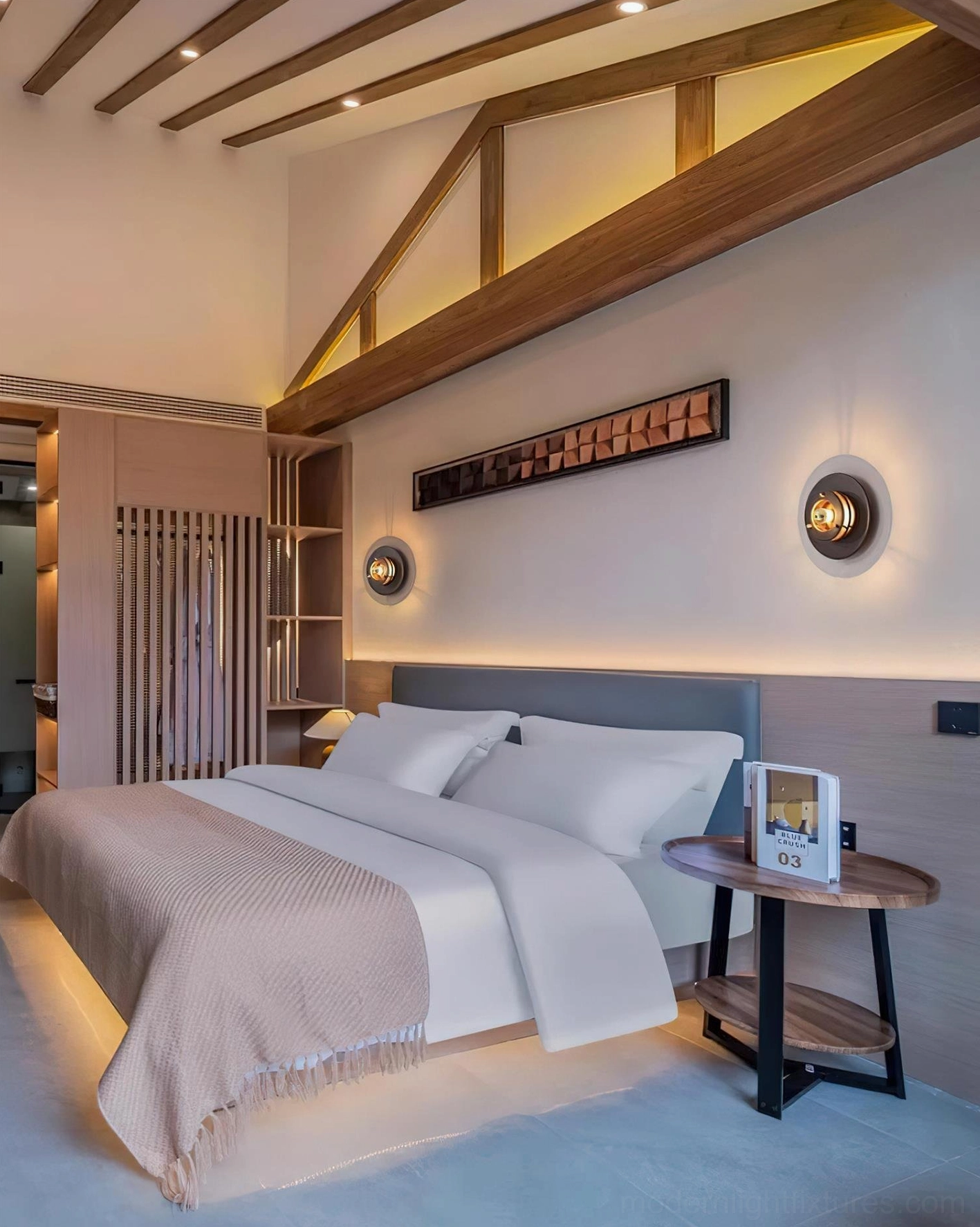 Pair of Jaima wall sconces installed symmetrically on attic bedroom headboard accent wall for balanced lighting design
